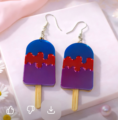 Red and purple popsicle-shaped acrylic earrings with silver hooks on a soft neutral background